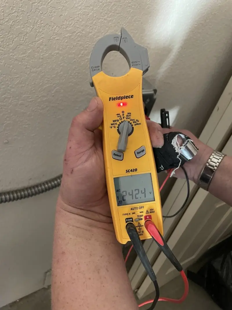 Voltage testing with clamp meter during Generator Installation in Casa de Oro-Mount Helix